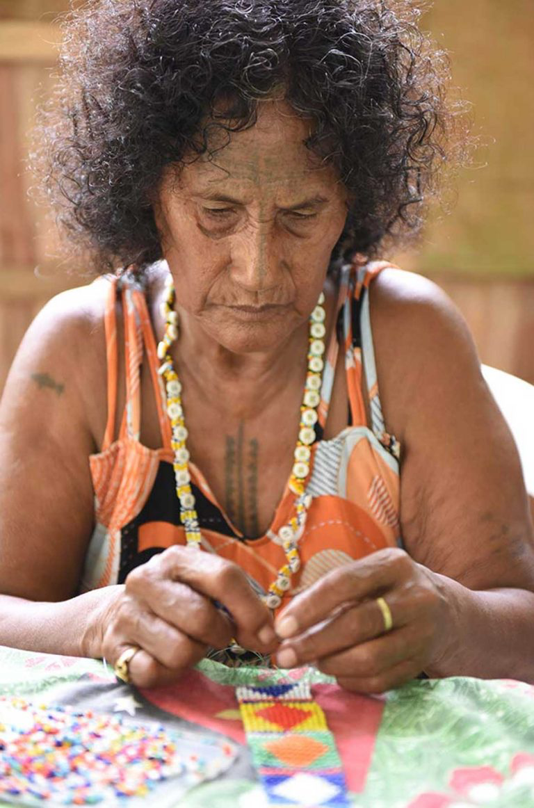 Aidah Hito Pais beading during Women's Wealth workshop