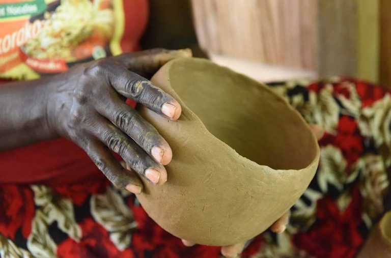 Imelda Vaevavini Teqae building a pot during Women's Wealth workshop